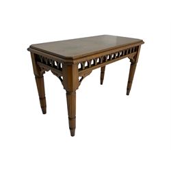 Late 19th century oak ecclesiastical side table, the rectangular top with canted corners, pierced arcade frieze with carved and pierced trefoil decoration, on turned and reeded supports