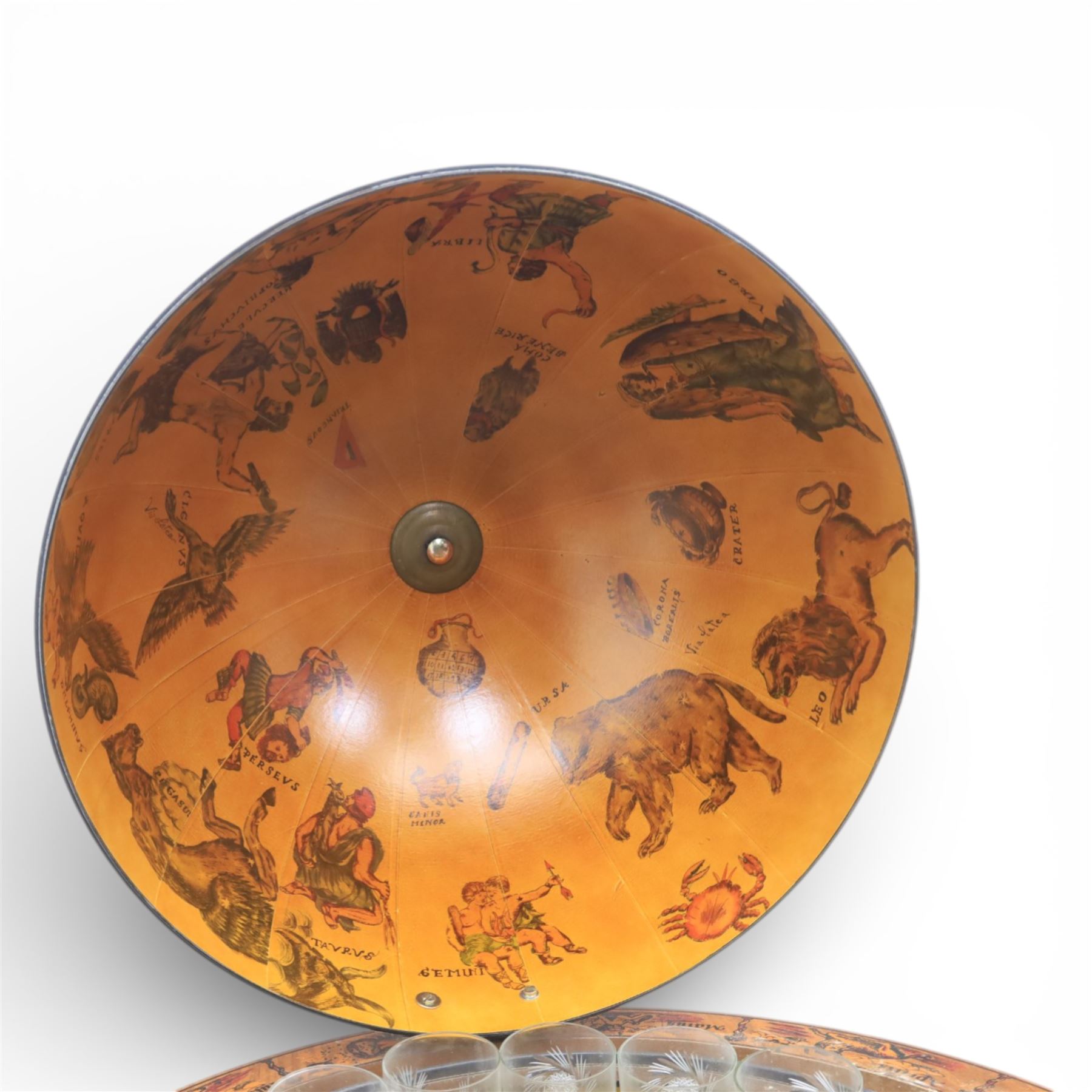 Late 20th century drinks globe, with lift off top with rotating inside with apertures for bottles, raised on brass castors