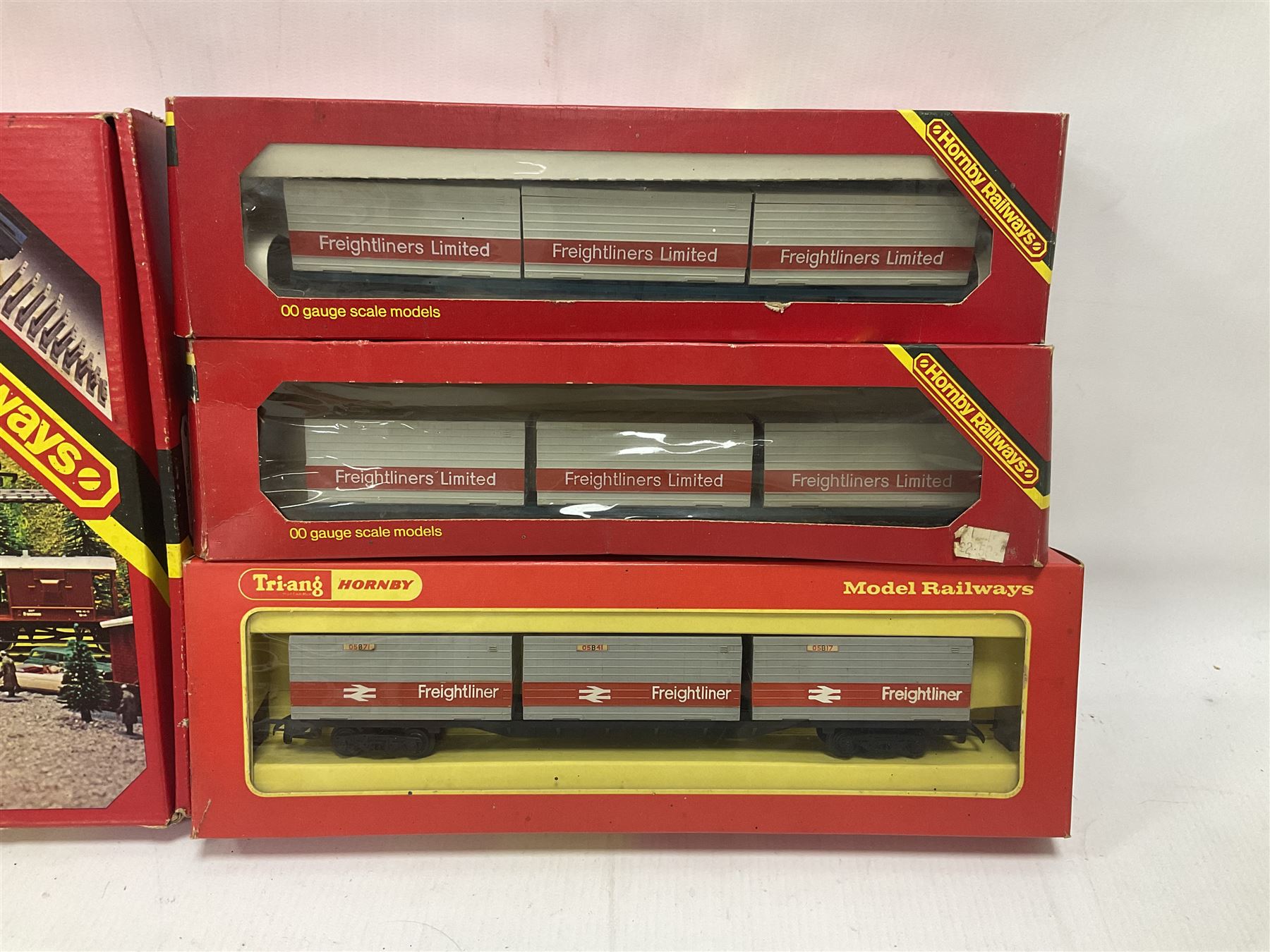 Hornby/Tri-Ang ‘00’ gauge - fifteen goods wagons to include freightliners with containers, ore wagons, closed vans etc; together with R404 Operating ore wagon set; all boxed (16) 