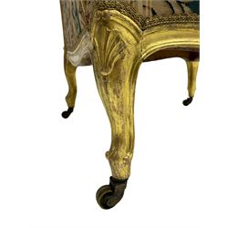 William Bertram & Son of London - pair late 19th century giltwood armchairs, moulded frame with scroll carved back and arm terminals, upholstered in striped fabric with foliate pattern, on shell carved cabriole supports, the brass castors stamped 