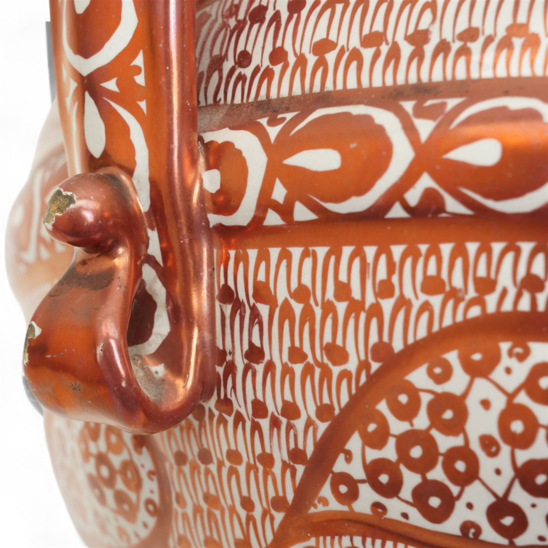Hispano-Moresque copper four-handled lustre vase, decorated with repeating leaf and foliate patterns, H30cm 
