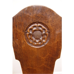 Gnomeman oak milking stool by Thomas Whittaker of Littlebeck, solid shaped back with carved rose, three supports, W32cm  