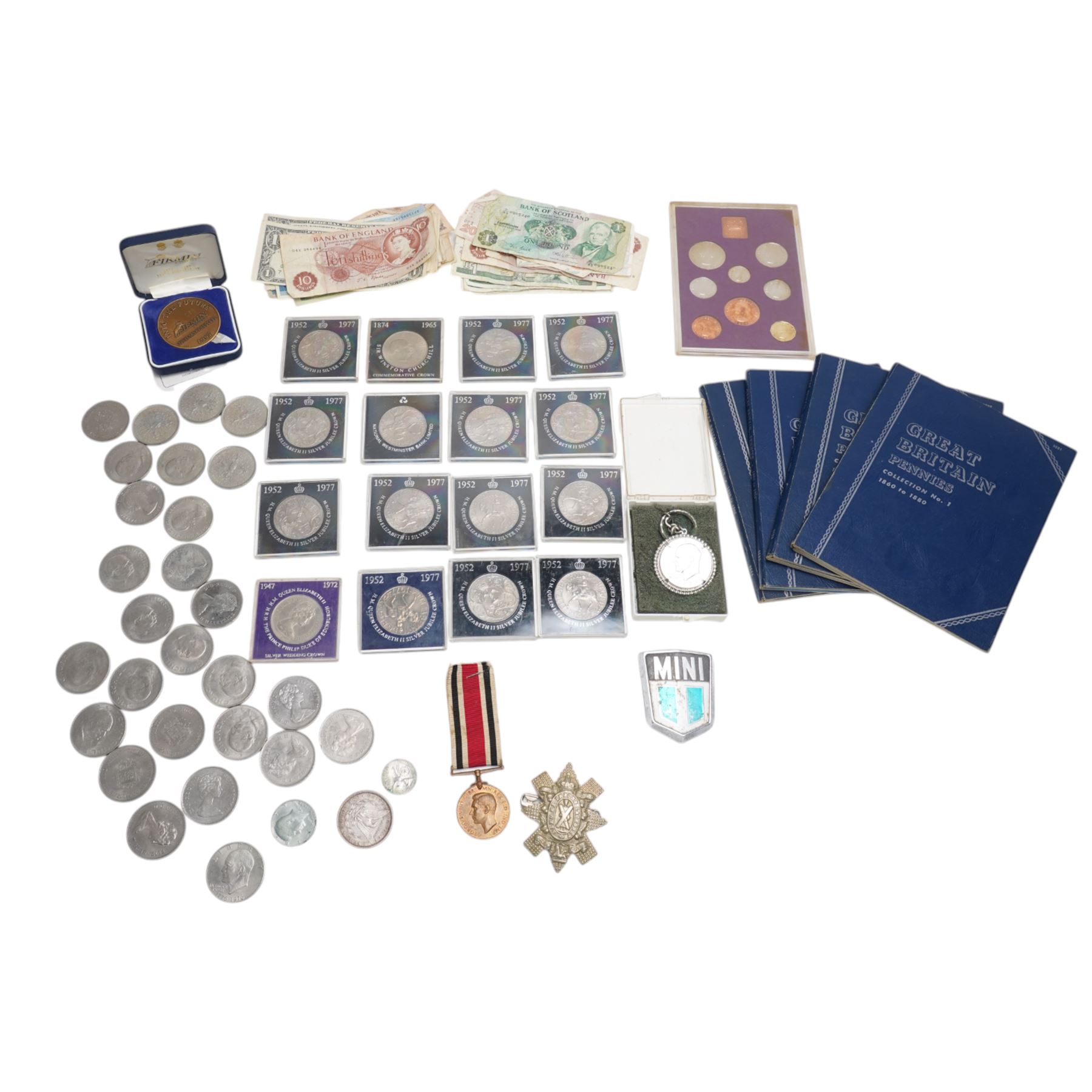 USA 1879 silver one dollar coin, George VI Special Constabulary Long Service Medal awarded to John Carmichael, Great British commemorative crowns, part filled Whitman folders, further coins and banknotes, etc, housed in metal case