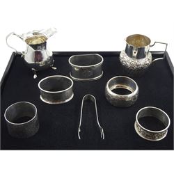 Silver milk jug, embossed foliate decoration by John Grinsell & Sons, London 1899, one other, five silver napkin rings and a pair of sugar tongs, all hallmarked, approx 7.6oz