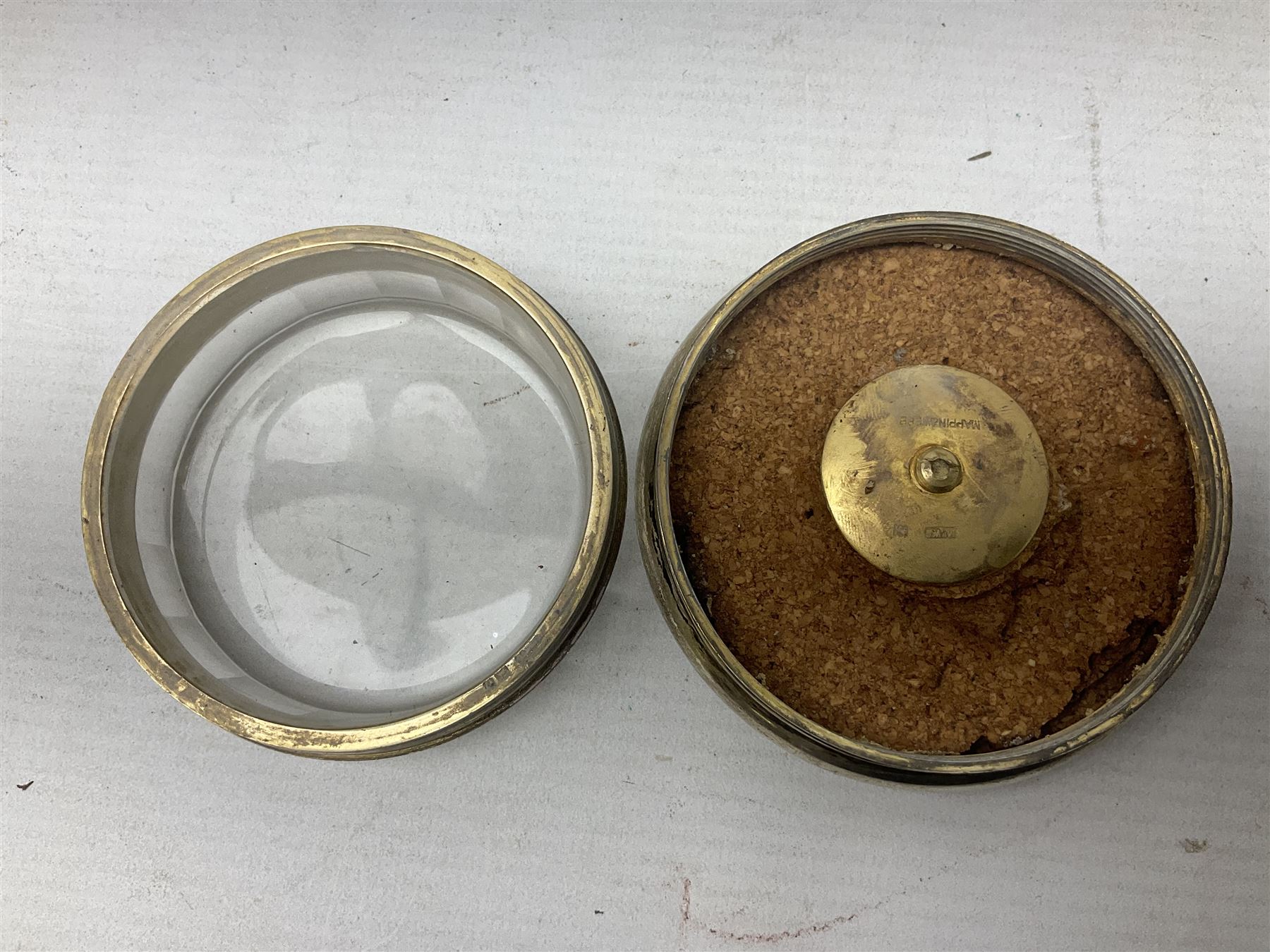 Pair of early 20th century glass dressing table jars, or circular facet cut form, with silver covers, hallmarked London, probably 1912