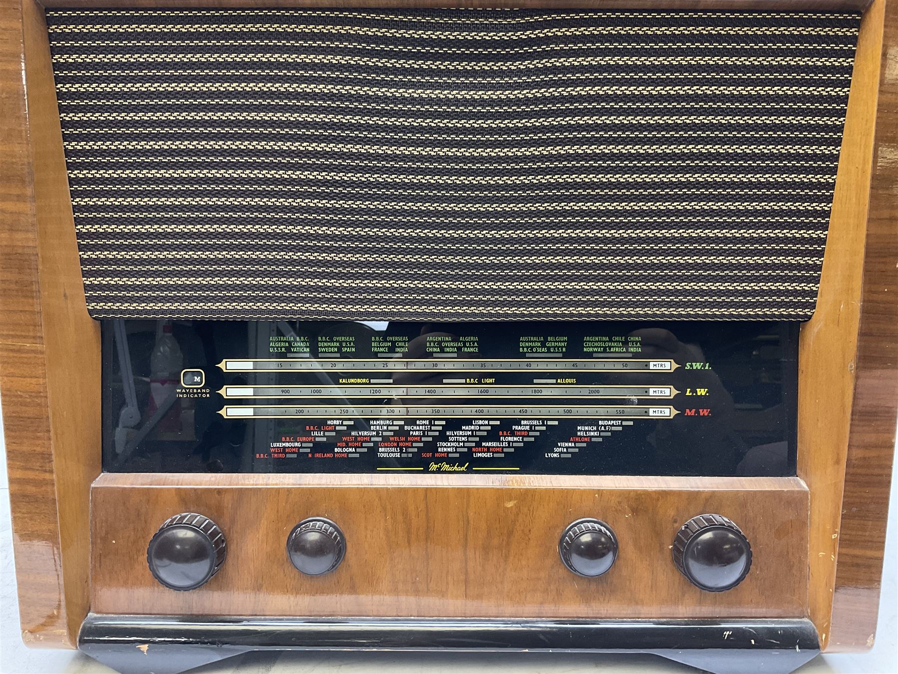 1955 Pye Fenman II valve radio in walnut veneered case, W58cm, together with a 1950s McMichael Type 854 valve radio with Bakelite knobs, W47cm H39cm D24cm, and 1957 Ekco Type A320 radio in dark walnut veneered case (3)