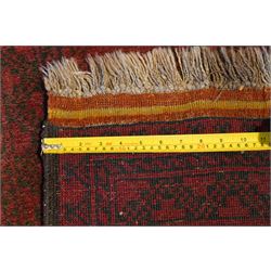 Antique Persian Bokhara red ground runner rug, repeating Gul pattern, surrounded by borders, with fringed ends