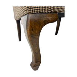 Hardwood-framed wingback armchair, upholstered in dog tooth pattern fabric, on cabriole supports 