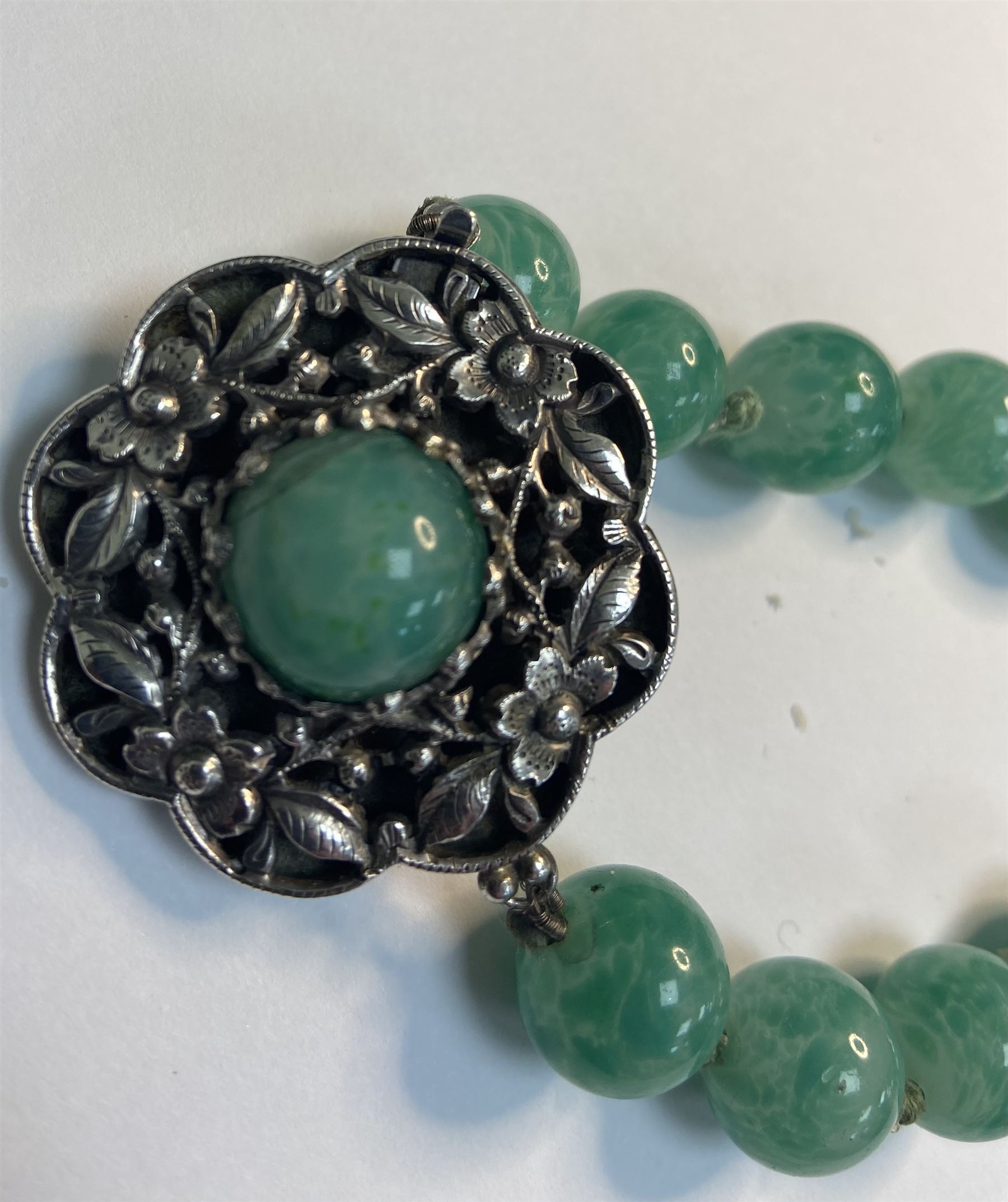 Chinese jade bead necklace with silver open work clasp with a cabochon greenstone/possibly jade bead necklace, signed Liu with Chinese character marks