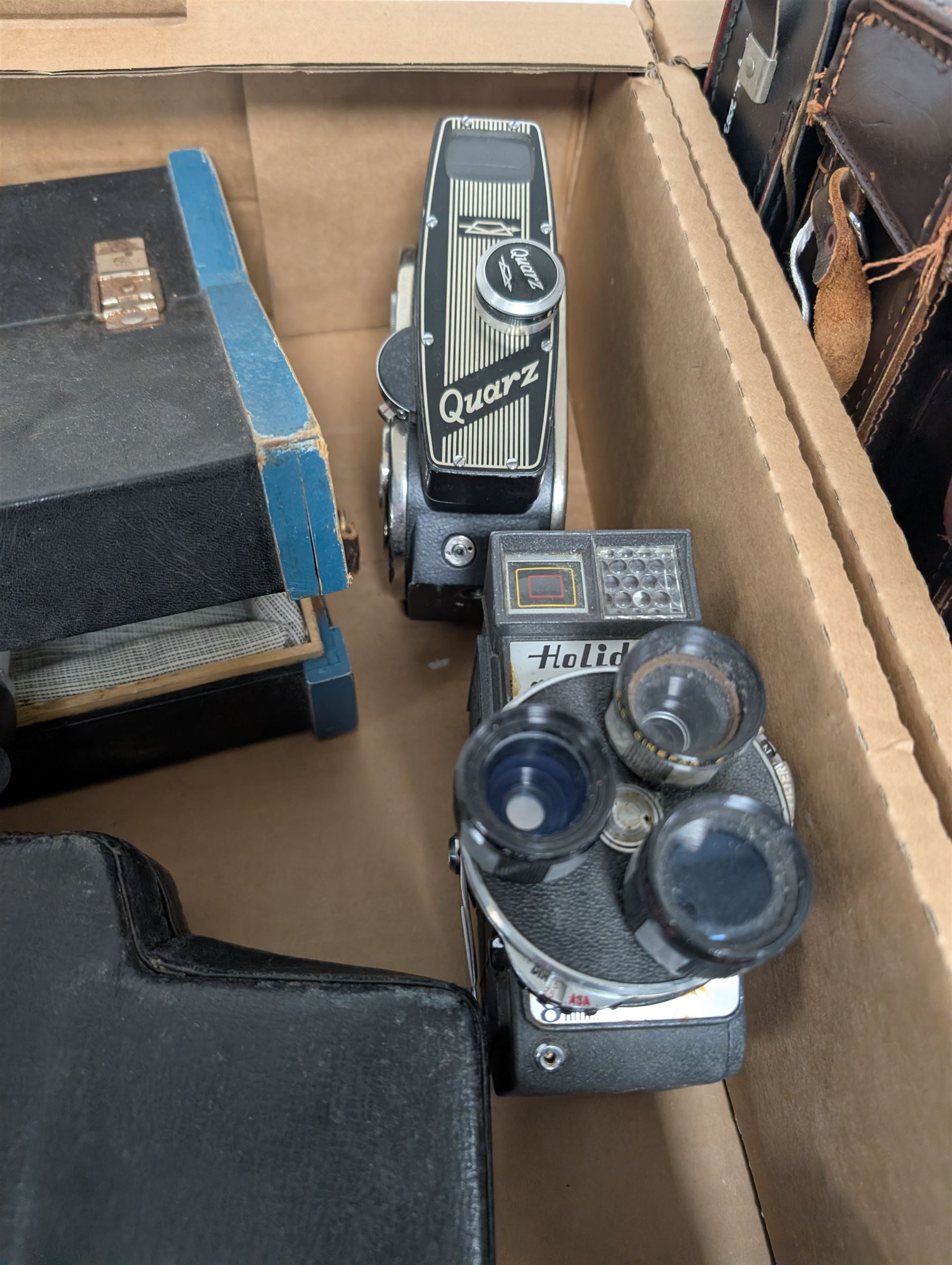 Collection of vintage cine cameras, including Bolex Paillard B8L, Mansfield Holiday Meter Matic, Quarz, Bell & Howell Autoset, Sankyo Super Micro, Canon Demi C, Agfa Movexoom, etc