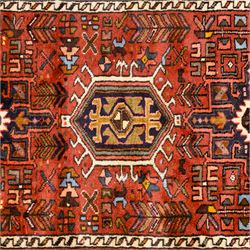 North West Persian Heriz hand-knotted runner, terracotta field decorated with a series of large angular medallions with stylized geometric motifs, surrounded stepped devices, and stylized trees within narrow geometric border, and polychromed edge, cotton fringe ends 