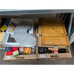 Collection of photography and photograph development accessories, including bulbs, development tanks, trays, projector lenses, etc