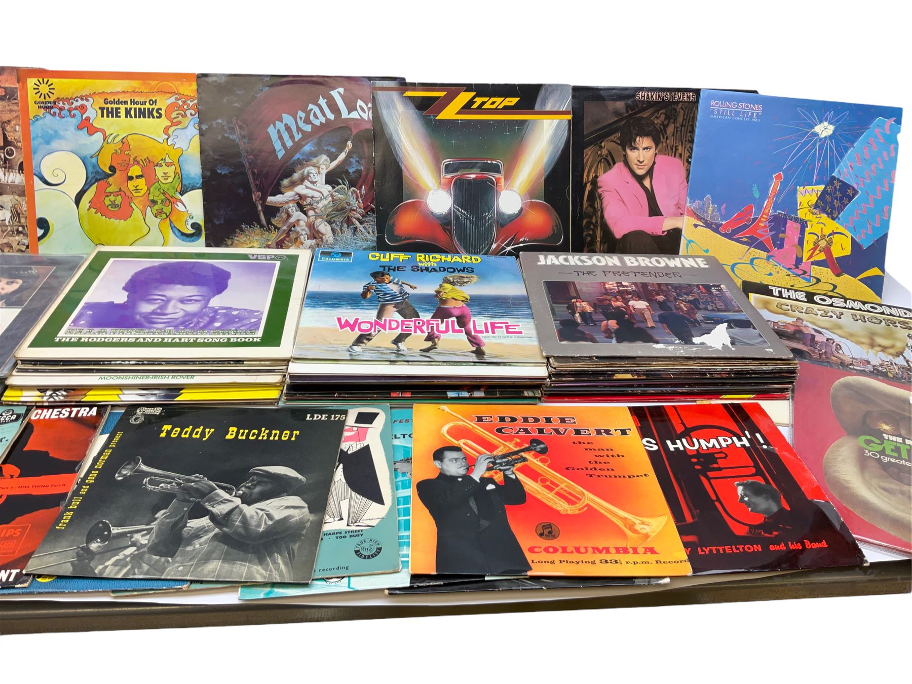 Over seventy LP records 1960s/70s/80s including seven Beatles, five Rolling Stones, Cliff Richard and The Shadows, Isaac Hayes, Jackson Browne, The Osmonds, Beach Boys, Duane Eddy, Buddy Holly, Elvis Presley, Carpenters, Thin Lizzy, Meat Loaf, Black Sabbath, Dubliners etc; and twelve 10