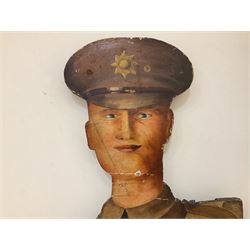 Military Outfitters hand painted life size wooden cut out figure of a WW1 soldier standing at ease holding a gun by his side, marked Stening Signs; hardboard on planked frame H199cm
