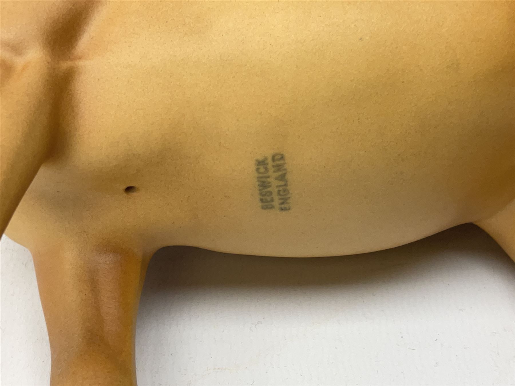 Collection of Beswick horses, including grey horse no.701, palomino foal no 836, grey stocky jogging mare no.855 etc, together two Royal Doulton horses, (8)