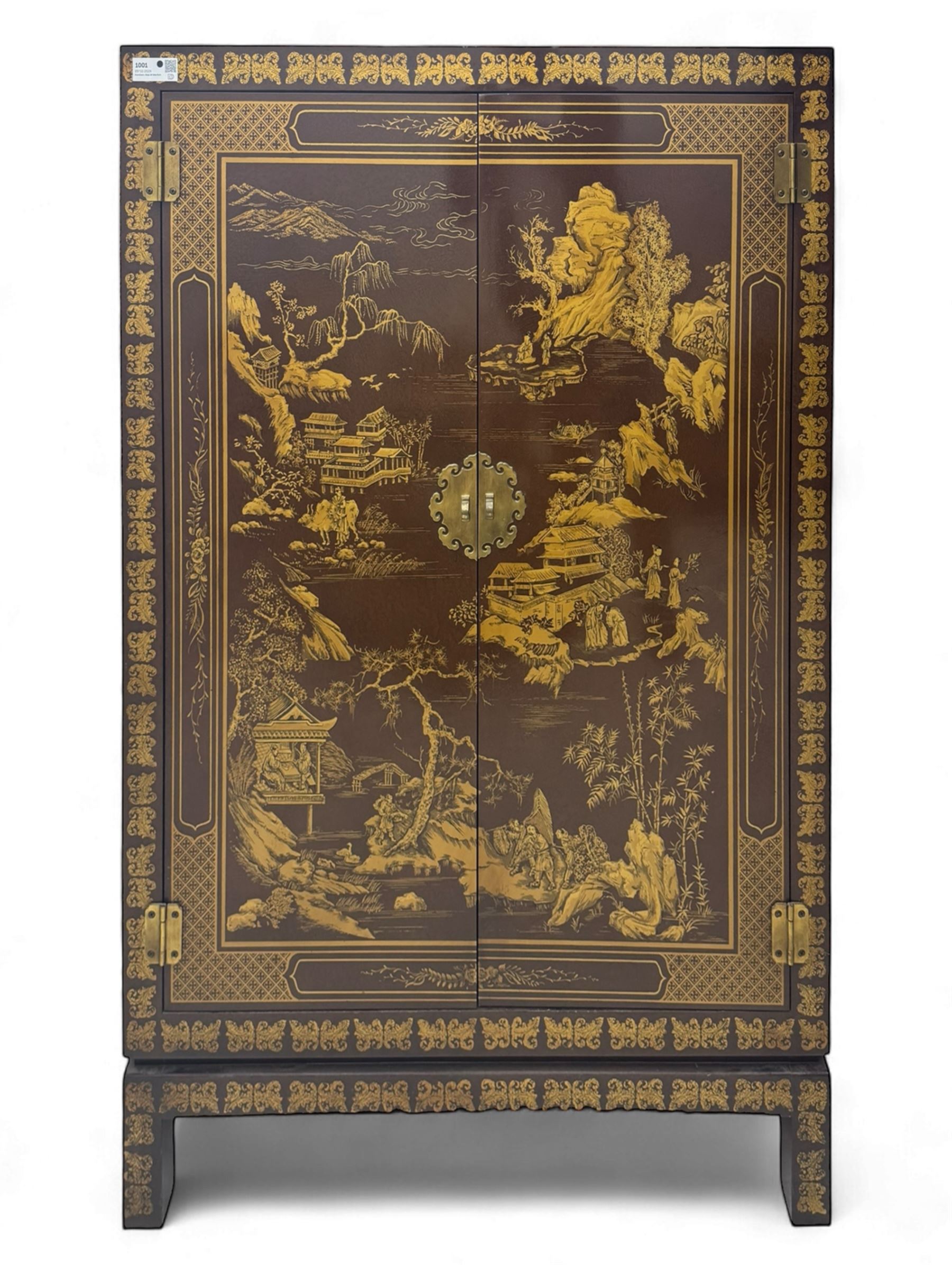 Chinese brown lacquered cocktail cabinet, decorated with gilt scenes of a traditional landscape with figures, pagodas, and mountainous scenery, double doors opening to reveal fitted interior with mirrored back, wine rack, shelves and cupboard, raised on square supports