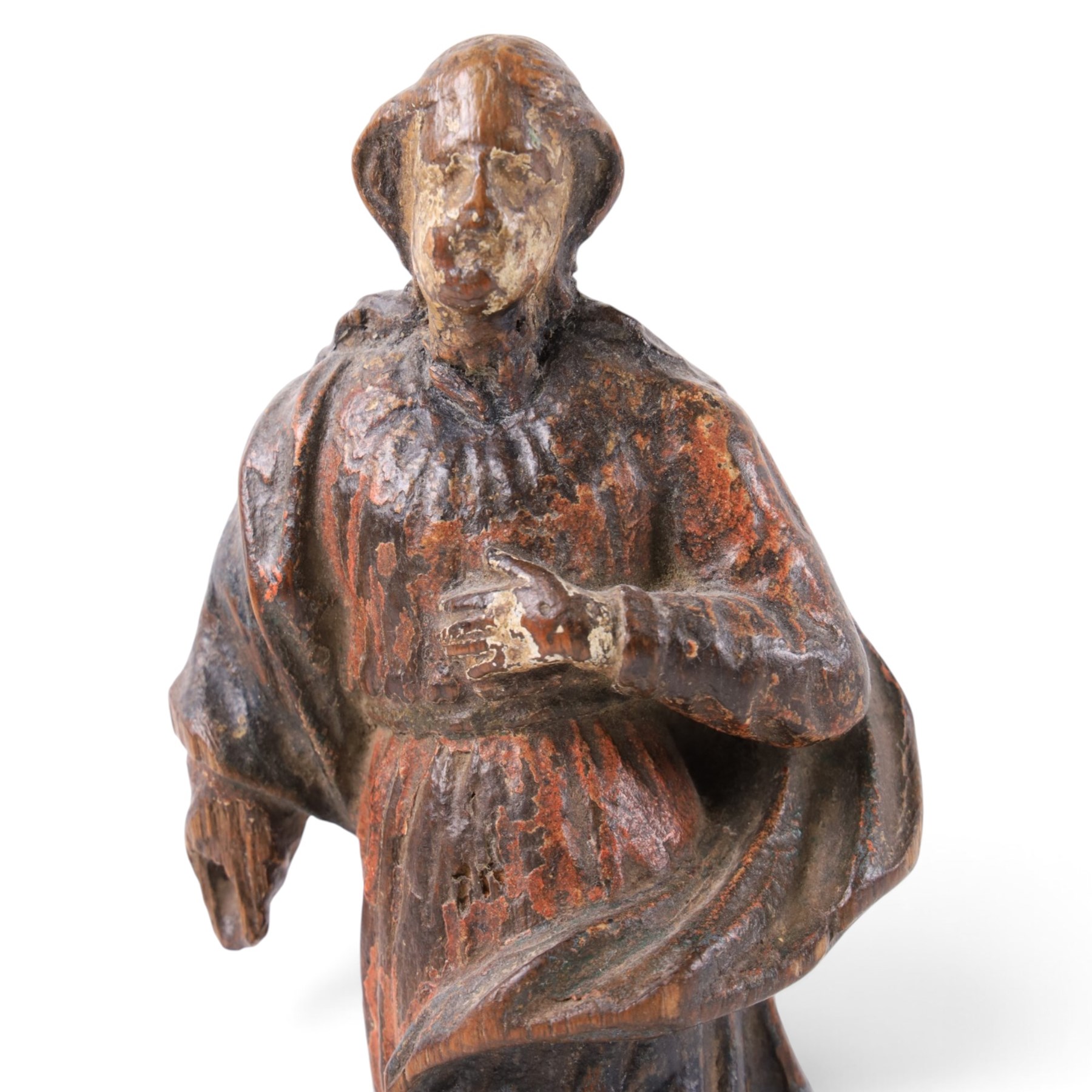 17th century, continental figure of saint, with painted polychrome detail, the figure adorned in robes, with hand on chest, upon a later wooden plinth, H31cm