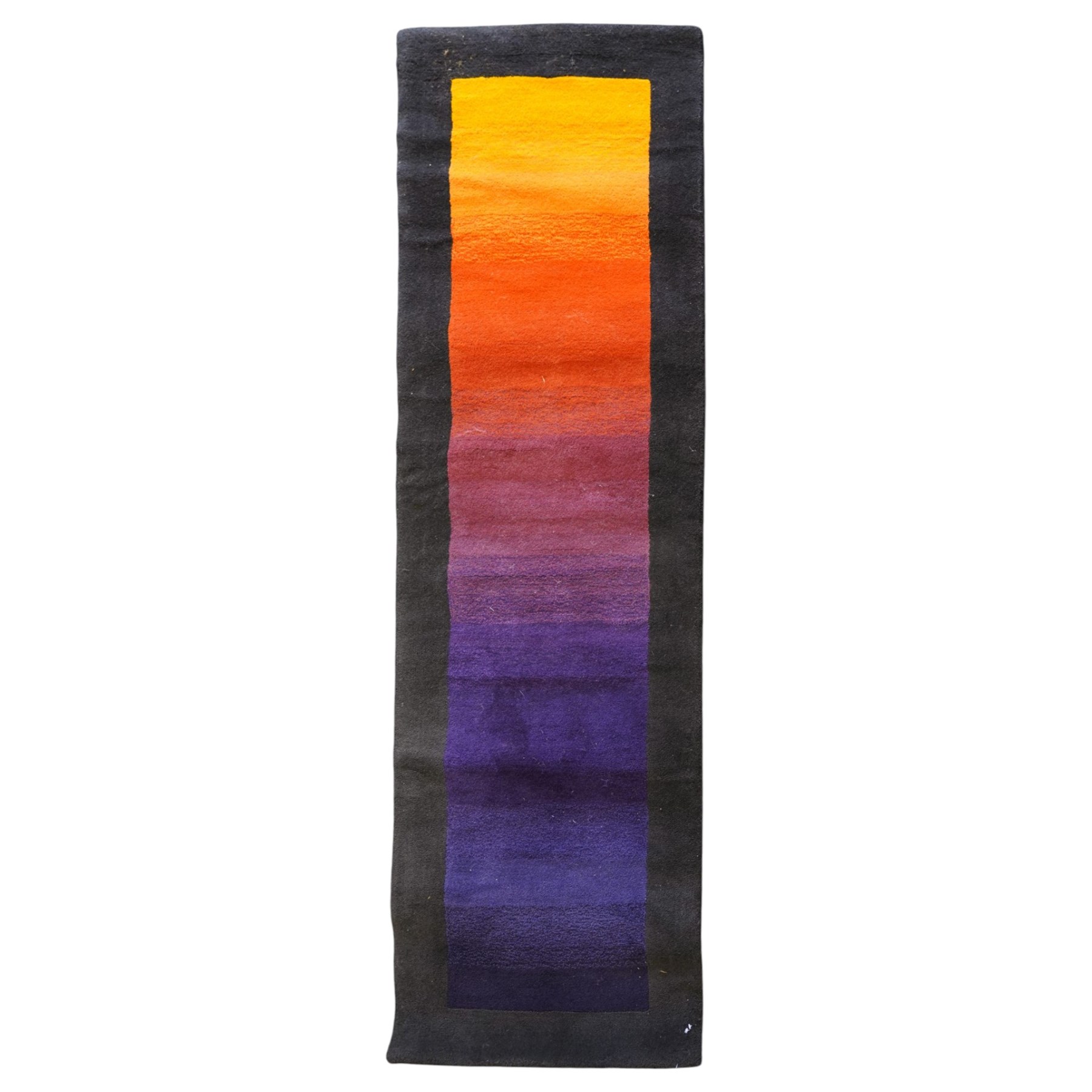 Contemporary wool runner rug, the field in a vibrant vibrant sunset-to-purple gradient with a wide dark indigo guard band