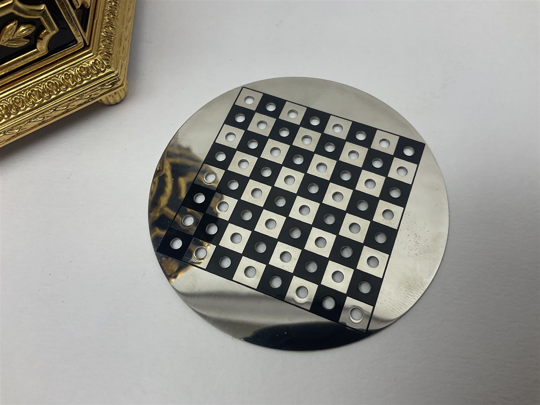 Franklin Mint House of Faberge; The Imperial Jeweled Egg Chess set, the egg opening to reveal a chess board, with a draw to the hexagonal base holding the miniature chess pieces, H23cm 