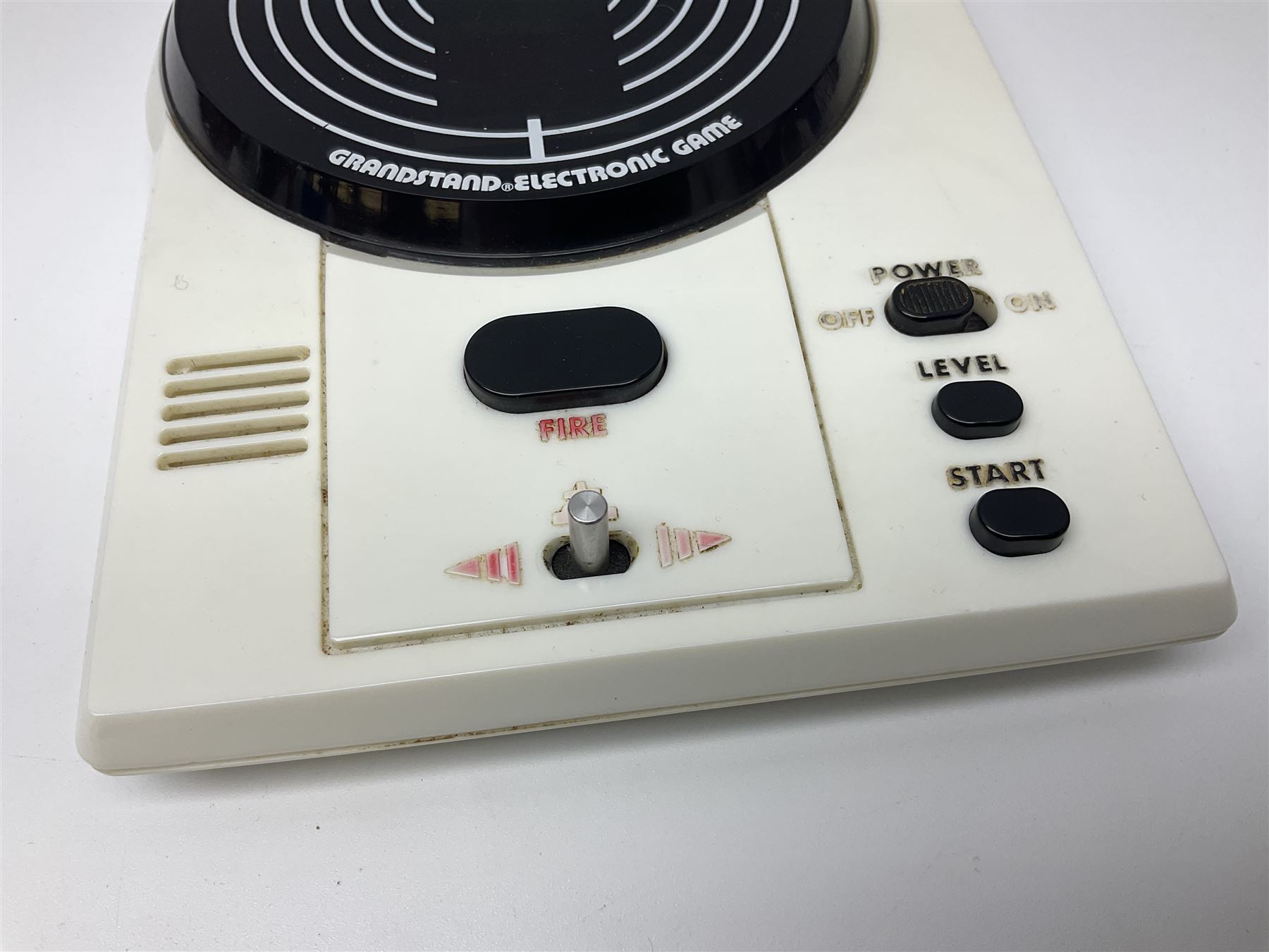 Three late 70s/early 80s handheld electronic games; Bandai Electronics Arcade ‘Gunfighter’ (1980), Grandstand ‘Invader From Space’ (1980), Palitoy ‘Merlin The Electronic Game Machine’ (1979) with game sheet and instruction booklet, all with original boxes (3) 