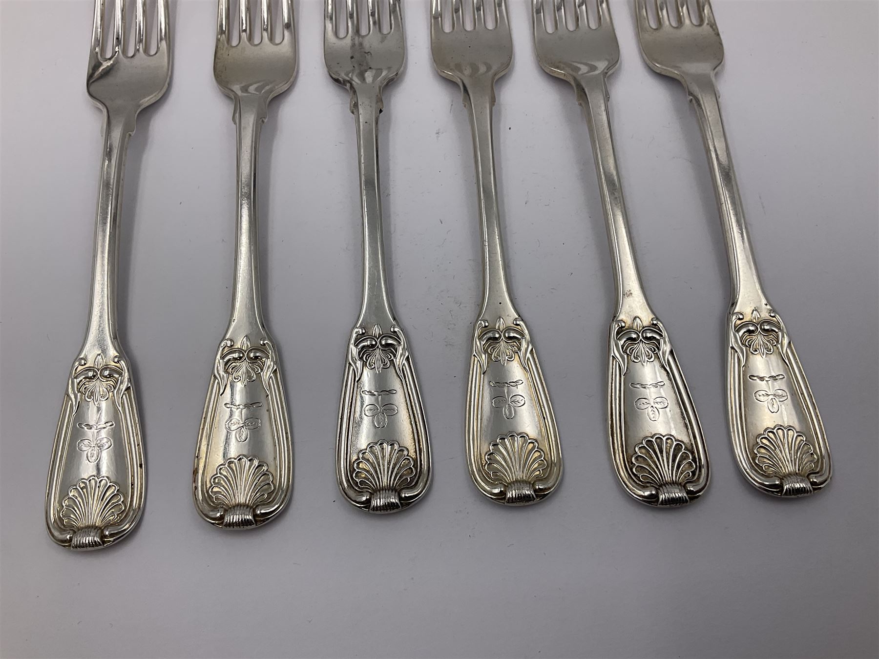 George IV Scottish silver Kings pattern cutlery for six place settings, to include table spoons, table forks, dessert spoons and dessert forks, all engraved with shamrock crest to terminal, hallmarked Robert Gray & Son, Glasgow 1833