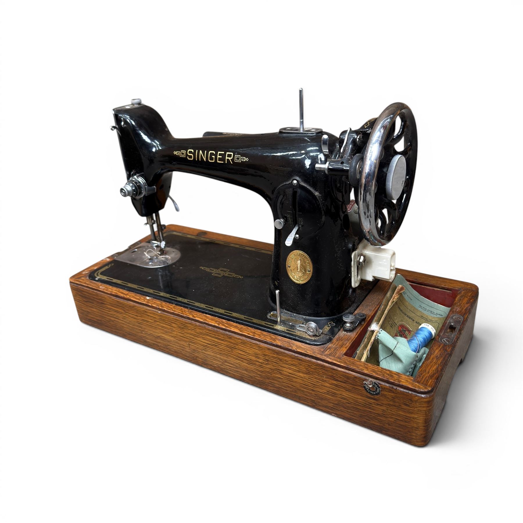 Three Singer wooden cased sewing machines 