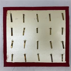 Twenty cap badges including Welsh Guards, Kings Royal Irish Hussars, York & Lancaster,  Loyal Suffolk Hussars, North Stafford, Durham Light Infantry, Cheshire, West Yorkshire, Norfolk, South Wales Borderers, Dorsetshire etc; mounted on a board for display