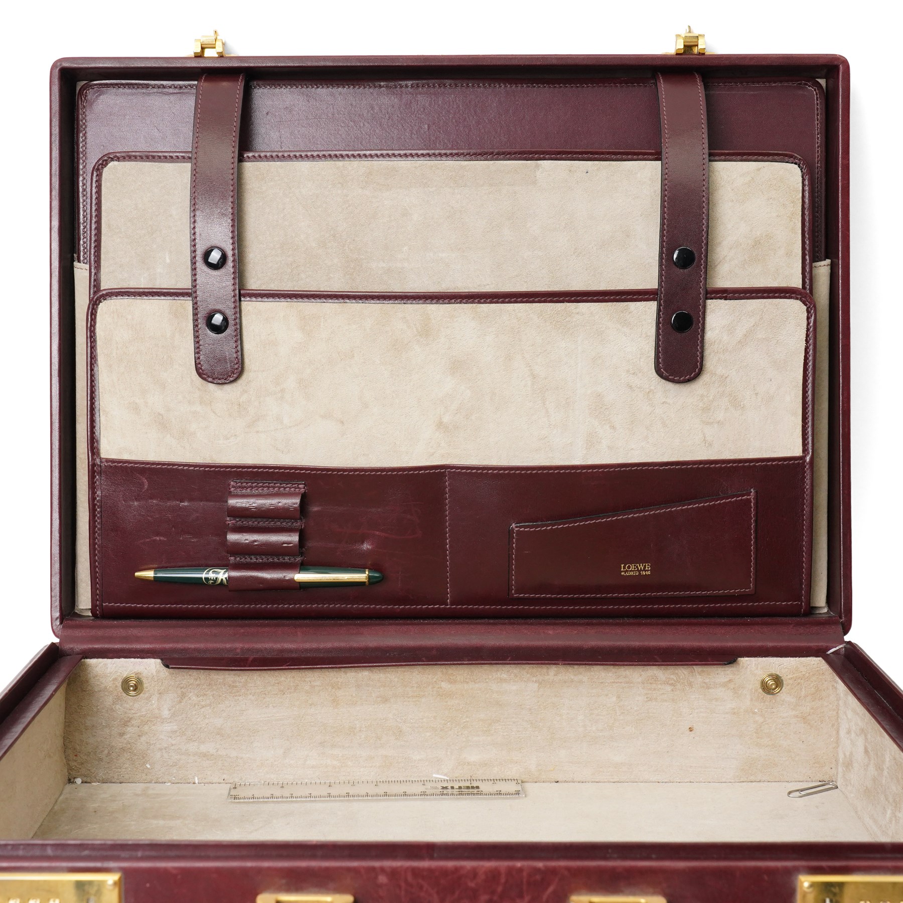 Loewe - vintage burgundy leather attaché case, the exterior embossed with Loewe Anagram, with gilt-tone hardware, twin combination locks and leather handle, opening to a suede-lined fitted interior with document compartments, pen loops and pockets, stamped LOEWE Madrid 1846