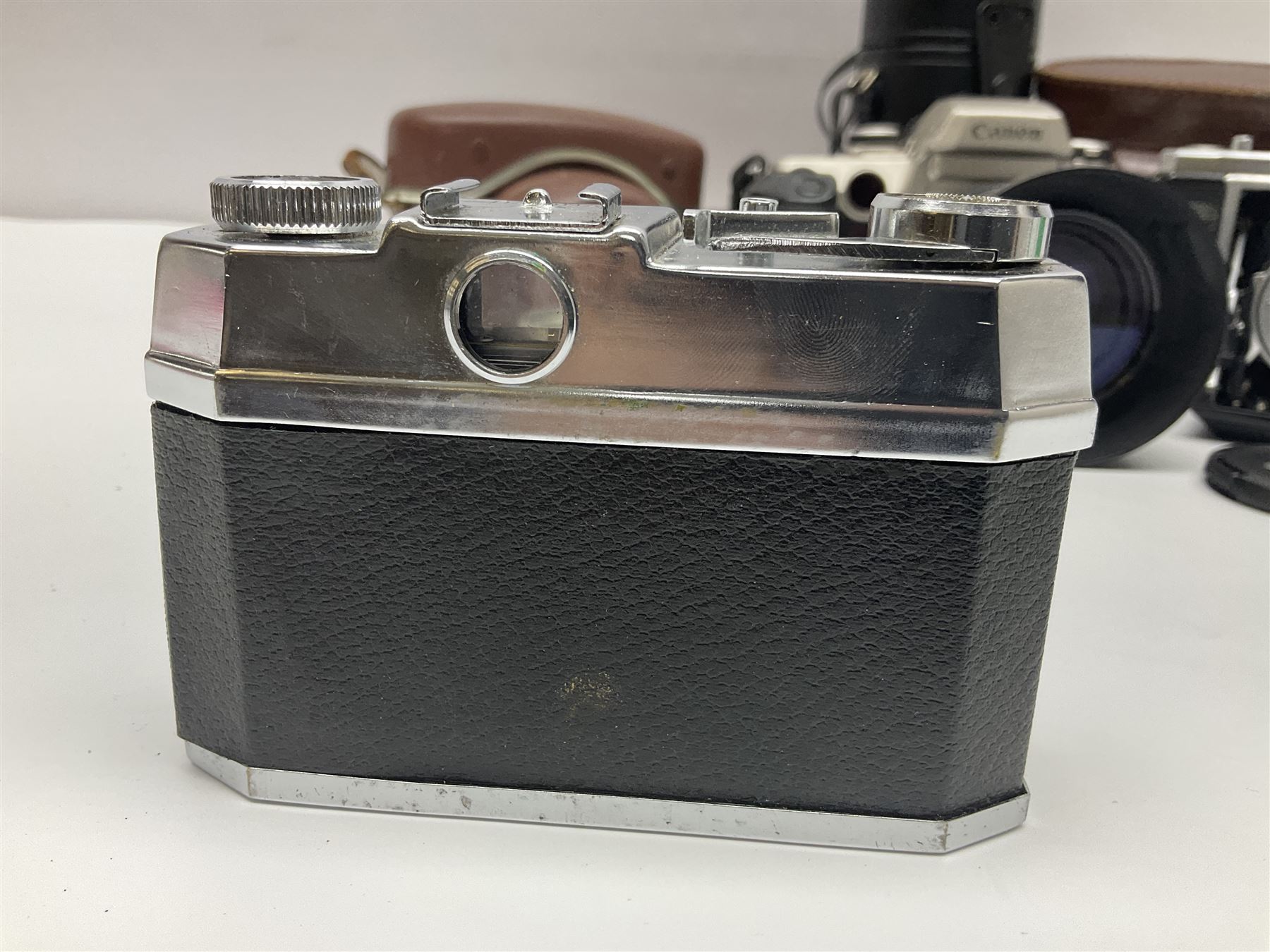 Canon EOS 50e camera body, serial no 8305671 with 'Canon Zoom EF 35-135mm 1:4-5.6' lens together with Halina 35X super camera body, with 'Halina Anastigmat f.c. 1:3.5 f=45mm' lens and other camera equipment 