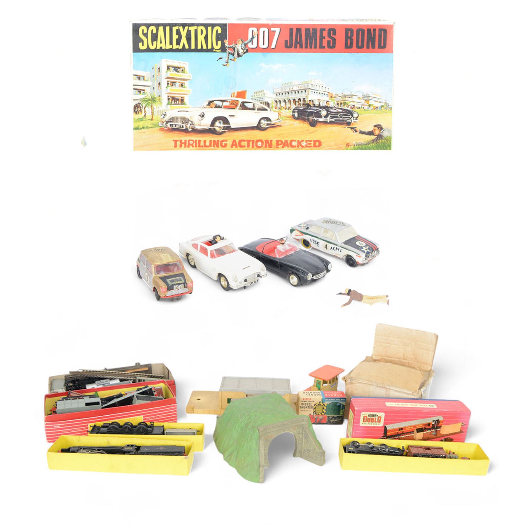 Scalextric James Bond 007 set, comprising two cars; 1967/68 Aston Martin DB5 in white with red interior, ejector seat and machine guns to front with James Bond and villain figure and  007 Mercedes 190SL in black with red interior with driver figure and sniper figure, with two blue controllers, track and instruction booklets, in original box