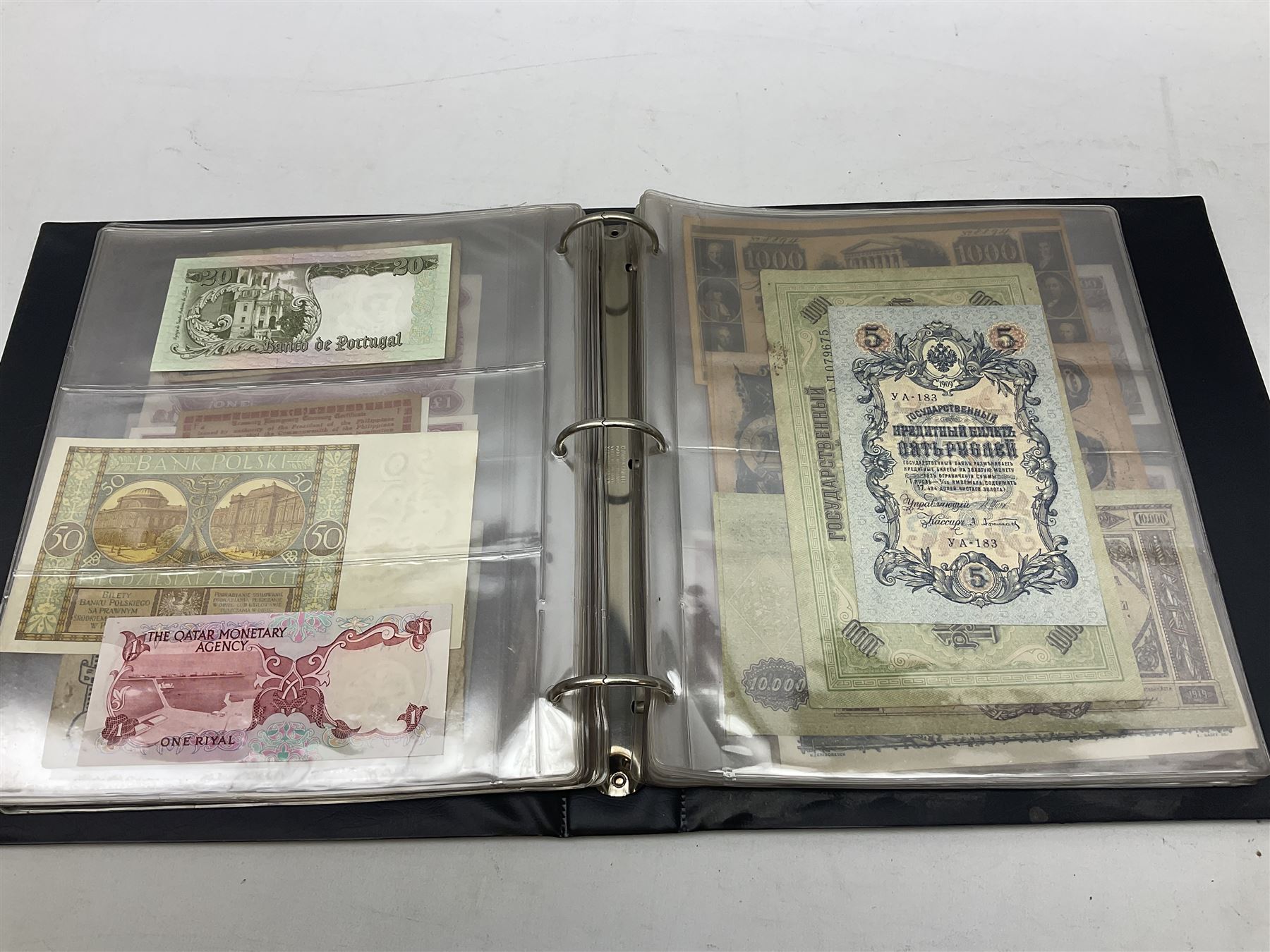 World banknotes, including Queen Elizabeth II The States of Jersey one pound 'DB202703', five pounds 'BB527762' and ten pounds 'AB651481', reserve bank of New Zealand two dollars '1L3 741894', King George V Straits Settlements one dollar 1st January 1935 'F/83 28924', various Bank of England notes etc, housed in two ring binder albums