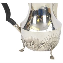 1920s silver hot water pot, with chased and repousse decoration to body depicting pheasants and rabbits in a countryside setting, with Bakelite type handle and finial, upon three palmette mounted feet, hallmarked S Blanckensee & Son Ltd, Birmingham 1928, H22cm