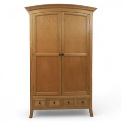 Contemporary oak double wardrobe, with fitted hanging rail above two drawers, raised on splayed feet