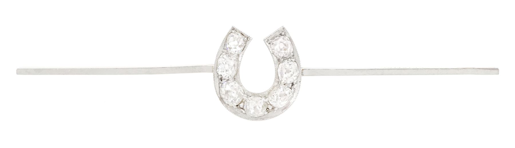 Early 20th century gold old cut diamond horseshoe brooch, stamped 15ct Plat, total diamond weight approx 1.05 carat, in velvet and ilk lined box