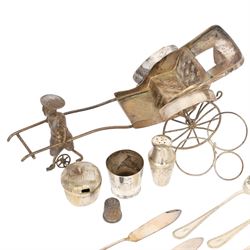 Silver cutlery comprising three teaspoons and two butter knives, a silver handled hook and a silver plated Chinese rickshaw cruet