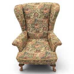 Parker Knoll - pair of mid-20th century wing back armchairs, upholstered in tapestry fabric, raised on cabriole legs