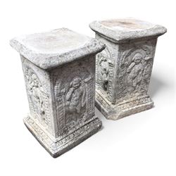 Paid of square cast stone plinths with a classical design