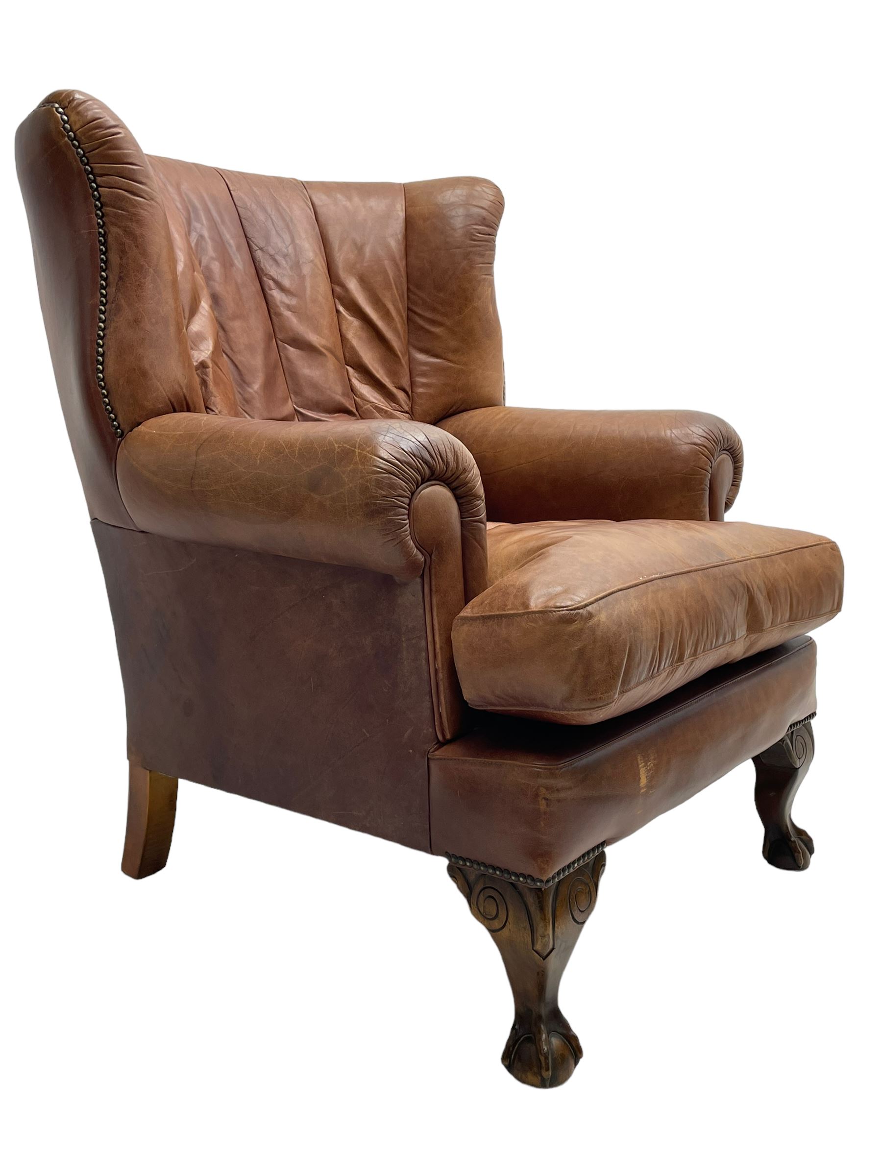 Tetrad - 'Blake' club armchair, fanned wingback and rolled arms upholstered in tan brown leather, on ball and claw carved cabriole feet 
