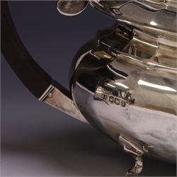 Early 20th century silver four piece tea service, comprising hot water pot, teapot, open sucrier and milk jug, each of part fluted oval form upon four stepped feet, the teapot and hot water pot with ebonised handle and finial, hallmarked Stephenson & Law, Sheffield 1918