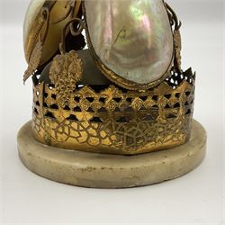 Victorian evening dinner bell, with three mother of pearl shells, floral and grape gilt decoration, and bird finial, raised upon a circular soapstone base with gilt pierced gallery, H14cm