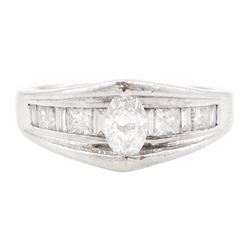 Platinum diamond ring, the marquise cut diamond of approx 0.45 carat, raised above channel...