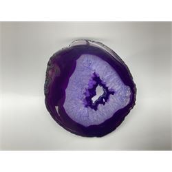 Pair of purple agate slices, polished with rough edges, raised upon gilt metal stands
