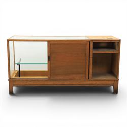 Early 20th century oak framed and glazed haberdashery shop counter with sliding doors and cupboards
