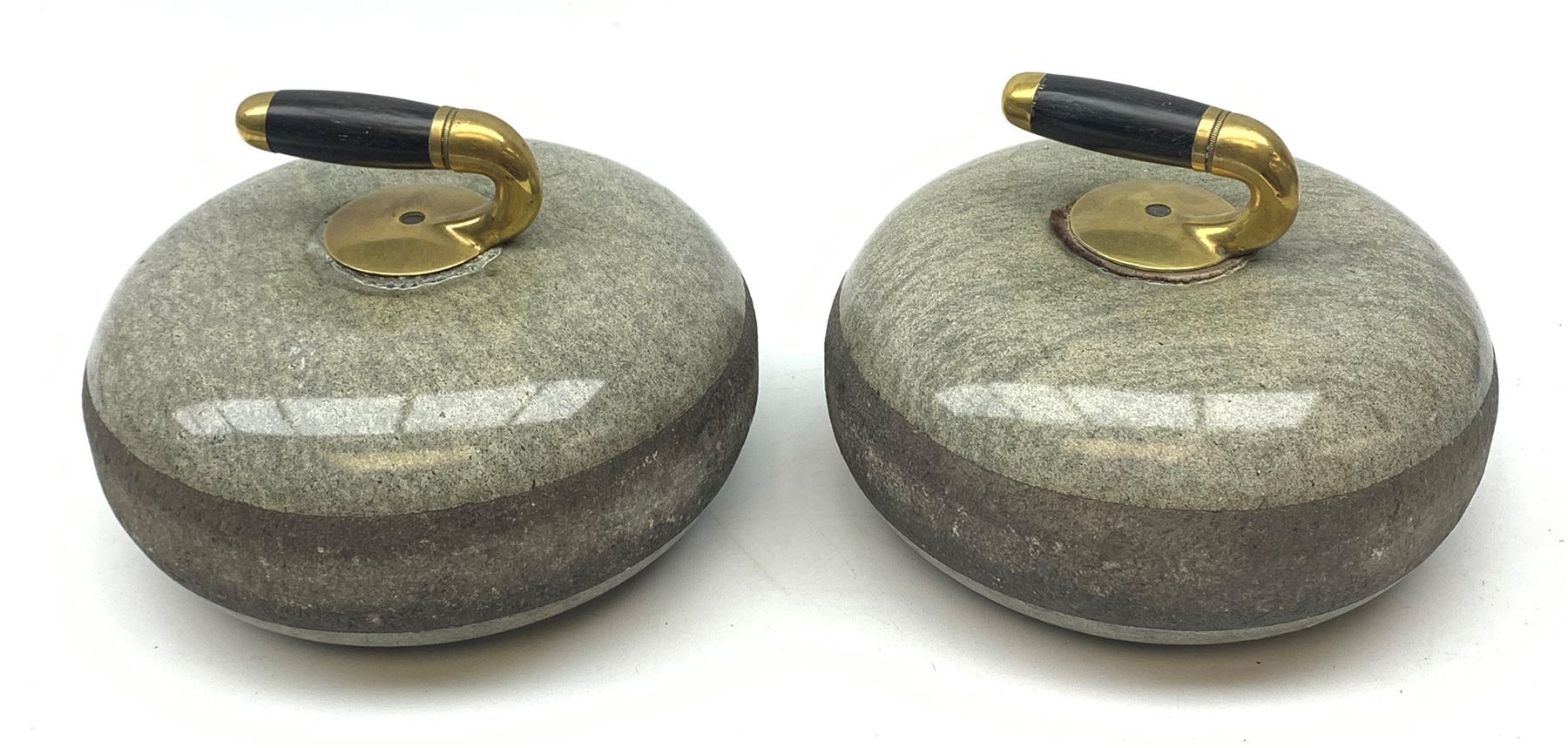 Pair of early 20th century Curling Stones, the bronze handles with