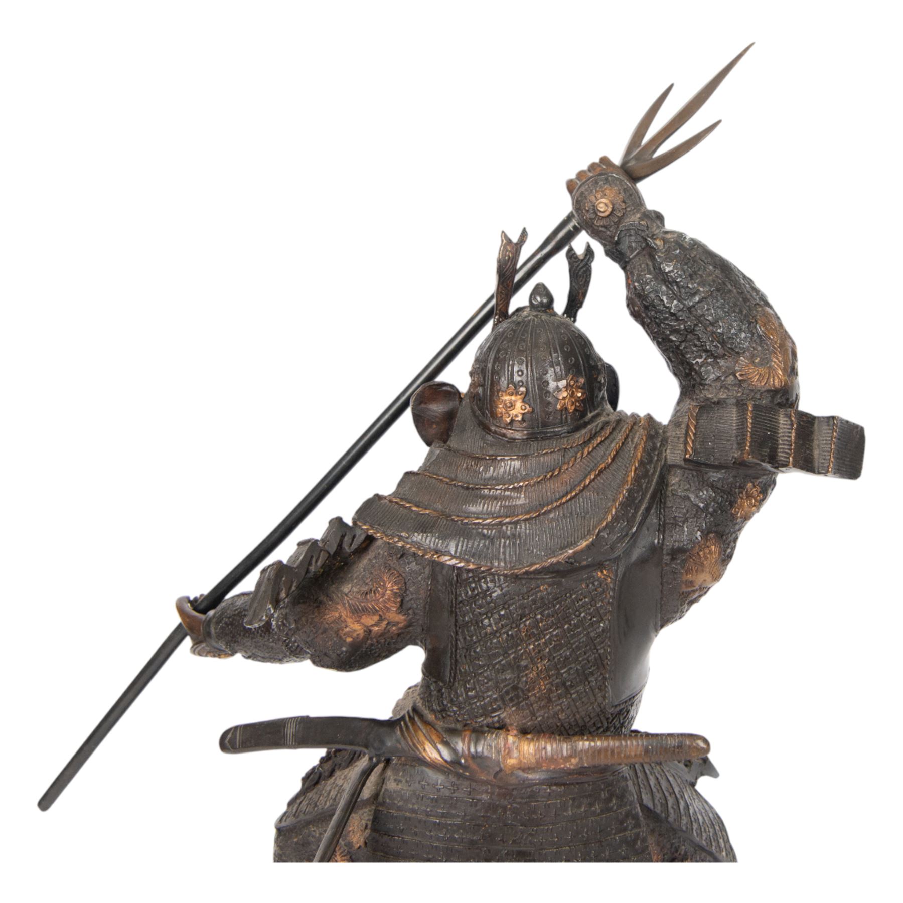 Japanese bronze of a Samurai, possibly Meiji period, standing holding a three pronged spear, on a wave form base, H67cm