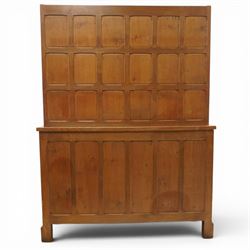 Cat and Mouseman - adzed oak dresser and plate rack, plate rack with two delf rack, panelled back and shaped uprights, above a base with two short drawers and turned wooden handles, panelled cupboard doors and sides, raised on a plinth base, with carved Cat and Mouseman signature, by Lyndon Hammell of Harmby