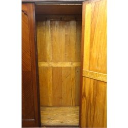 Edwardian mahogany wardrobe, projecting cornice, blind fret work above mirrored door, one drawer, bracket feet, W132cm, H202cm, D52cm  
