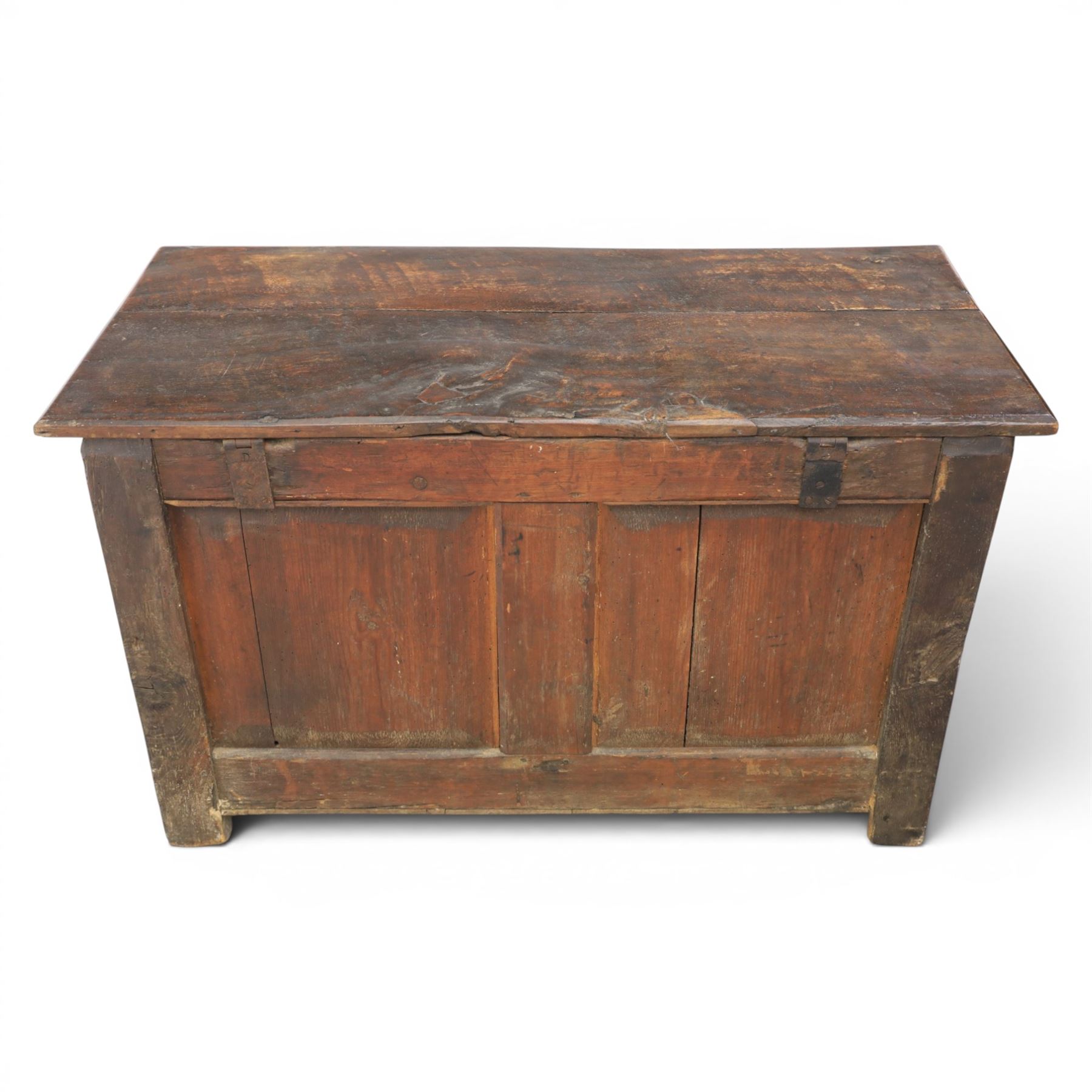 18th century oak coffer with carved frieze and rails, rectangular plank top with iron strap hinges, raised on stile supports