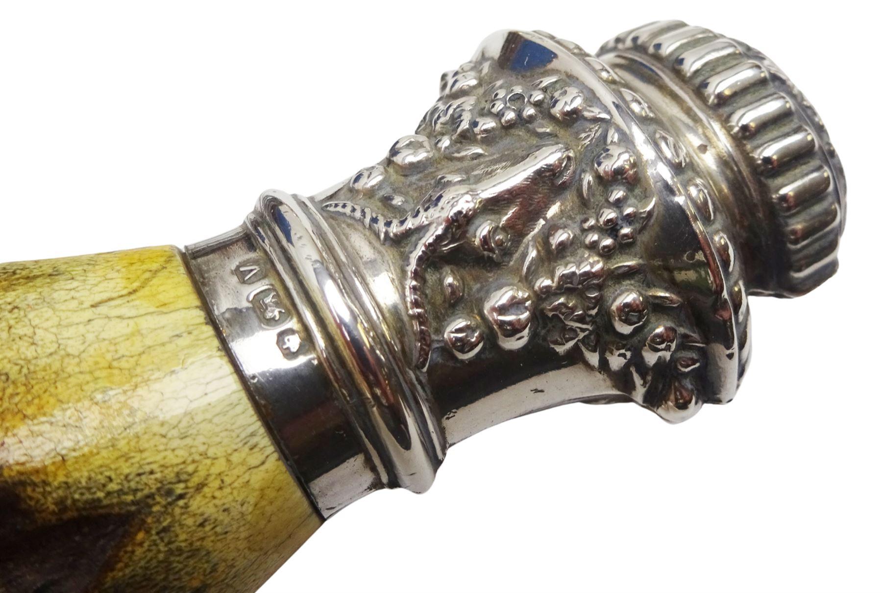 Victorian seven piece silver mounted antler handled carving set, the silver ferrules and terminals embossed with deer masks and fruit swags, hallmarked Francis Cholerton, and Mappin Brothers, Sheffield 1888, two steel blades stamoed J H Potter Cutler & Silversmith Sheffield, and one prong stamped J H Potter, contained within a fitted mahogany case with vacant brass cartouche to the hinged cover 

