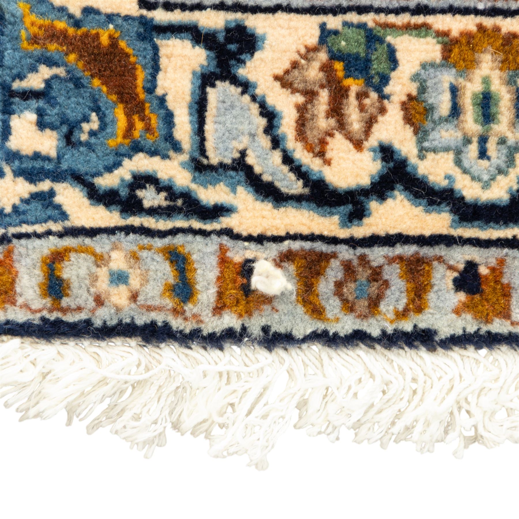 Persian Kashan rug, cream ground decorated with an all-over pattern of interlaced floral stems, rosettes and palmettes in blue, gold and rust tones, framed by layered floral borders, woven in the Kashan region of Iran